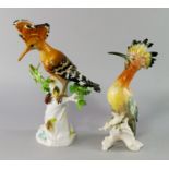 A Meissen model of a bird, late 19th/20th century, modelled perching in a leafy tree stump, with a