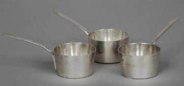 Three white metal brandy warmers
Typically modelled, with flag draped anchor mark.   (3) CONDITION