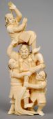 A Japanese carved ivory okimono
Formed as four samurai warriors, the underside signed.  19 cms high.