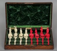 A 19th century Chinese carved and stained ivory chess set
The white set formed as Western figures,