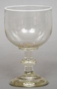 A large 19th century clear glass rummer
The lip decorated with a white enamel band.  20 cm high.
