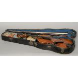 Two cased violins
Each with a single piece back; and each with two bows.  Each 59 cm long.