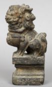 An antique Chinese carved hardstone temple dog
Typically worked, standing on an integral plinth