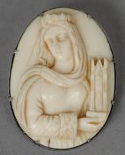 A carved ivory roundel
Worked with a female figure holding a model of a cathedral, now mounted as