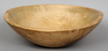 A 19th century turned sycamore bowl
Of typical form.  49 cm wide. CONDITION REPORTS: Two fillets