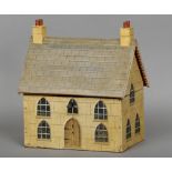 A naive Victorian house form tea caddy
Of large proportions, the hinged roof enclosing twin lidded