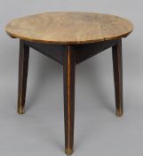 A late 18th/early 19th century elm cricket table
Of typical circular form above a moulded frieze,