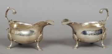 A pair of George III silver sauceboats, each hallmarked London 1767, maker's mark of WB
Each with