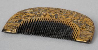 A late 19th century Japanese carved and gilt heightened tortoiseshell comb
Of arched form, decorated