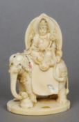 A 19th century shibayama decorated carved ivory group
Modelled as Buddha seated astride an elephant,