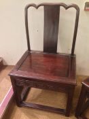 A pair of 19th century Chinese hardwood chairs
The shaped back above the serpentine splat over