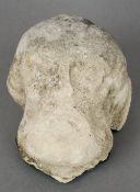 A carved stone head, probably Medieval
Worked as a saintly figure.  14 cm high. CONDITION REPORTS: