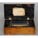 A 19th century rosewood and walnut cased Swiss cylinder music box
Playing six aires, the inlaid