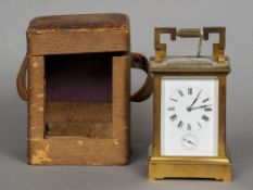 A 19th century brass cased carriage alarm clock
Of typical form, the white enamel dial with Roman