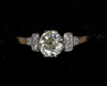 An 18 ct gold diamond ring
The claw set centre stone spreading to approximately 0.75 carat,