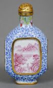 A finely decorated Chinese enamel snuff bottle
Of canted ovoid form with figural and scenic