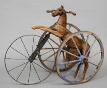 A 19th century French velocipede tricycle
Modelled as a prancing horse with cast metal head,