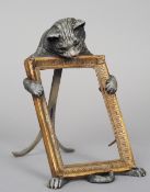 A cold painted bronze picture frame
Modelled being held by a cat.  24.5 cm high. CONDITION