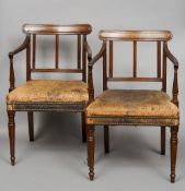 A pair of 19th century mahogany open armchairs
Each panelled bar back supported by fluted square