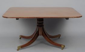 A 19th century mahogany tilt-top breakfast table
The top of rounded rectangular form, above the