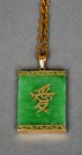 A 14 ct gold mounted apple green jade pendant
With applied Chinese character and 14 ct gold