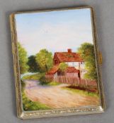 A gilt metal and enamel decorated cigarette case
The hinged cover worked with a cottage in rural