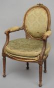 A 19th century French gilt heightened carved walnut open armchair