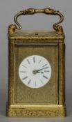 A 19th century brass cased repeating carriage clock
The case with ornate floral engravings, the