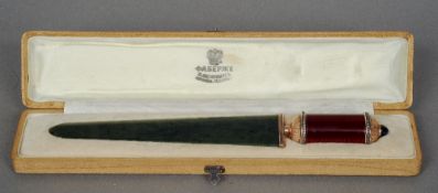 A cased Russian spinach jade silver and enamel decorated paper knife
The guilloche enamel