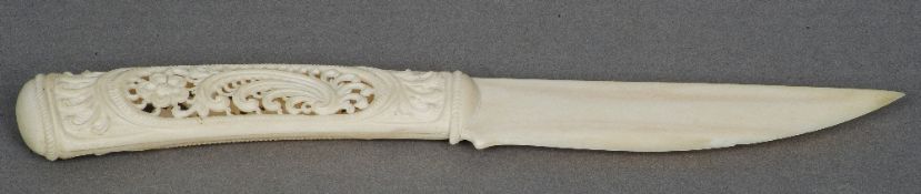 A late 19th/early 20th century carved ivory paper knife
The reticulated handle worked with scrolls.