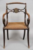 A 19th century beech framed cane seated open armchair
With rope twist top rail above a brass mounted