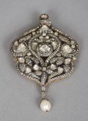 A rose diamond and pearl pendant brooch
Of pierced scrolling floral form, set with a small pearl