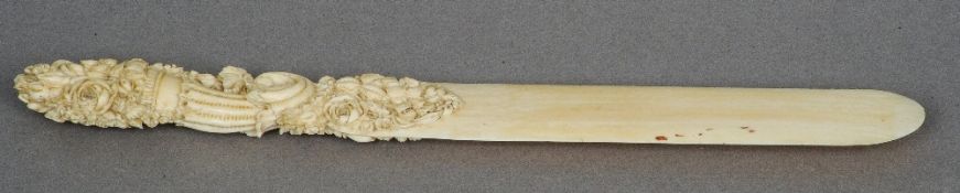 A 19th century carved ivory paper knife
The handle worked with a cornucopia issuing flowers.  26.5