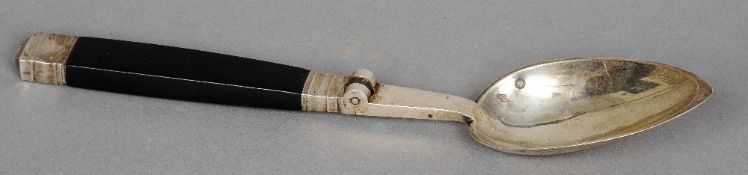 A 19th century French silver and ebony folding spoon, maker's mark of JB
The hinged handle inset