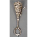 A white metal posy holder
The basket floral cast with vacant cartouche, the handle with loop