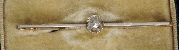 An unmarked gold and platinum diamond bar brooch
The central facet cut stones spreading to