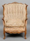 A 19th century French walnut framed upholstered armchair
The pierced scroll carved top rail above