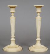 A pair of 19th century carved ivory candlesticks
Each of tapering columnar form, with spreading