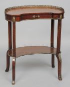 An Edwardian line inlaid mahogany kidney shaped side table
The pierced brass galleried top above a