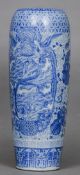 A Japanese blue and white porcelain vase
Of slender form, extensively decorated with dragons,