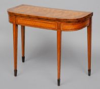 A George III kingwood, mahogany crossbanded and dog tooth inlaid satinwood card table
The baize