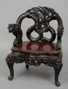 A Chinese carved hardwood armchair  With