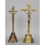 Two early Continental brass crucifixes
Typically modelled and with engraved decoration.  43.5 x 40