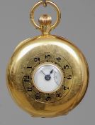 A lady's 18 ct gold cased half hunter pocket watch
The outer case with enamelled Arabic numerals,