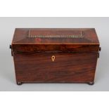 A William IV rosewood tea caddy of typical form with ring handles, fitted interior and flattened bun