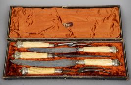 A cased bone handled carving set
The five piece set by James Deakin & Sons, Sheffield, each with a