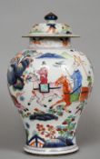 A 19th century Chinese porcelain vase and cover
Of tapering bulbous form, decorated with figures