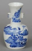 A Chinese porcelain blue and white vase
Decorated with figures in a continuous river landscape,