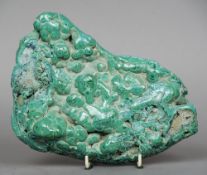 A malachite specimen
Of naturalistic form.  24 cm wide. CONDITION REPORTS: Overall good, some