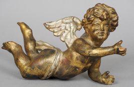 A 19th century carved giltwood and silvered model of a cherub
Typically modelled in flight.  27 cm